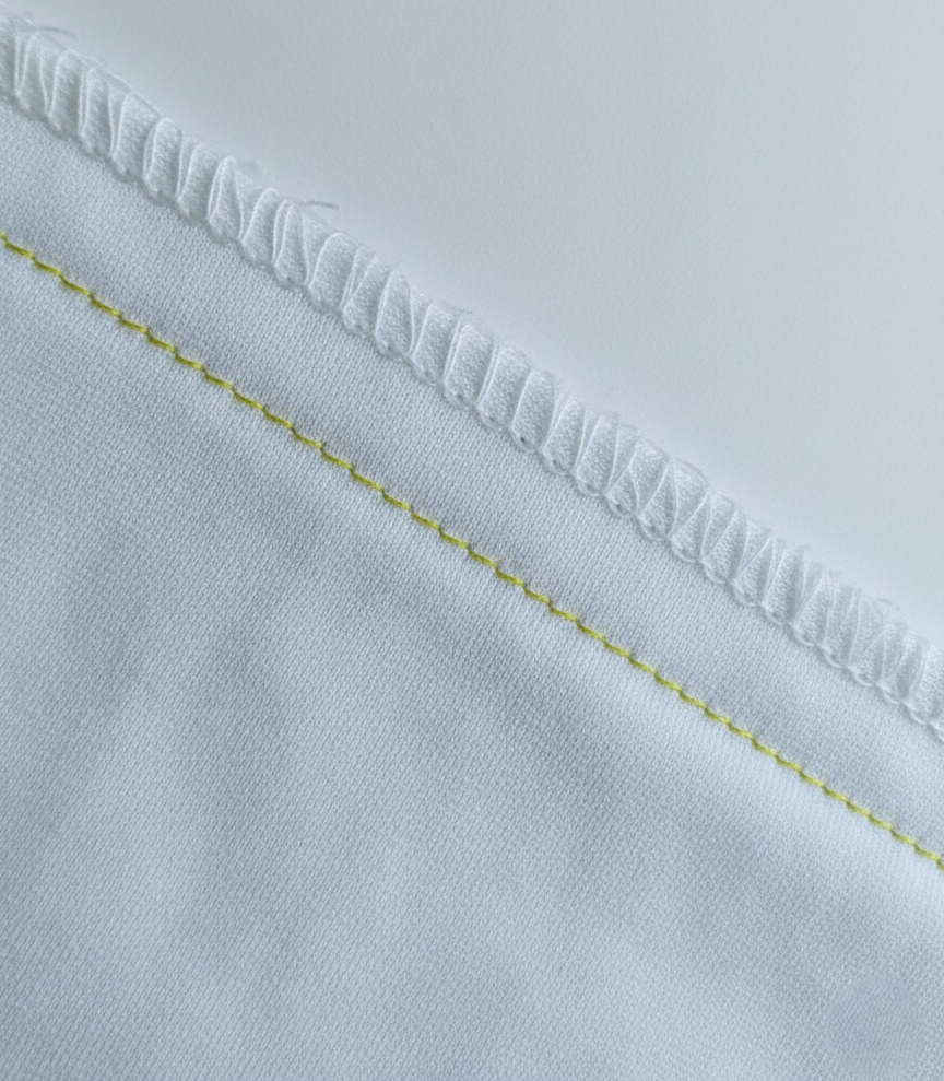 Raw Edge Exposed / Wrong or Excessively Loose Overlock